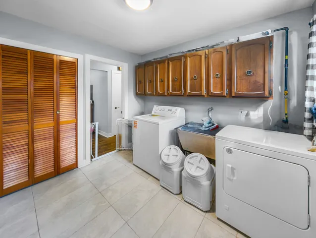 a kitchen with stainless steel appliances granite countertop a stove and a microwave