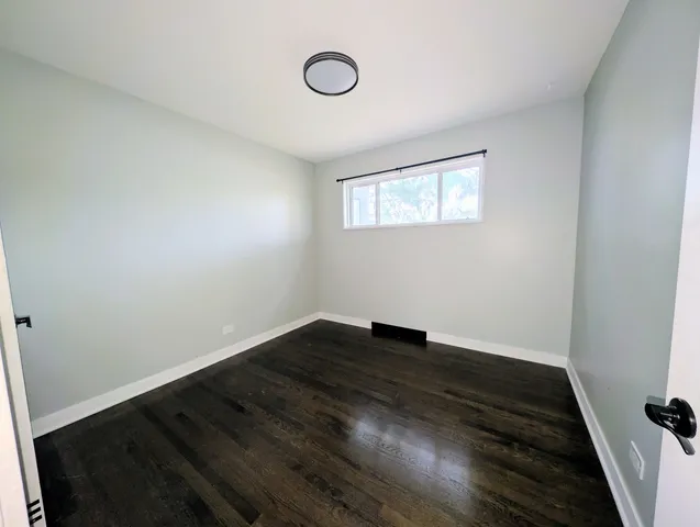 a view of a hallway with the wooden floor
