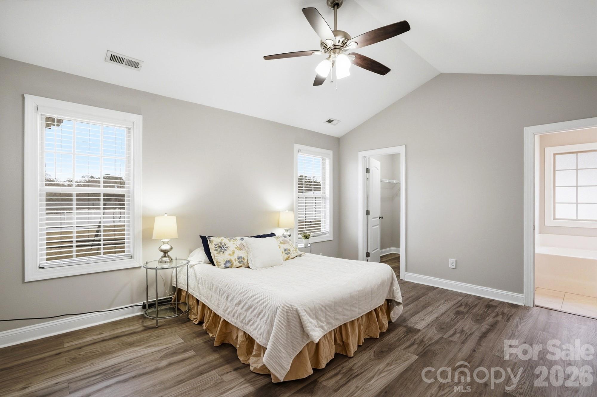 2122 Centergrove Road Kannapolis, NC 28083 - Photo 19 of 47 a bedroom with a large bed chandelier and a window