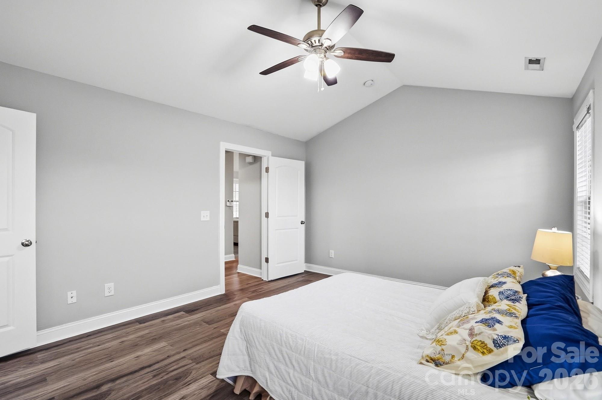 2122 Centergrove Road Kannapolis, NC 28083 - Photo 22 of 47 a bedroom with a bed and a chandelier