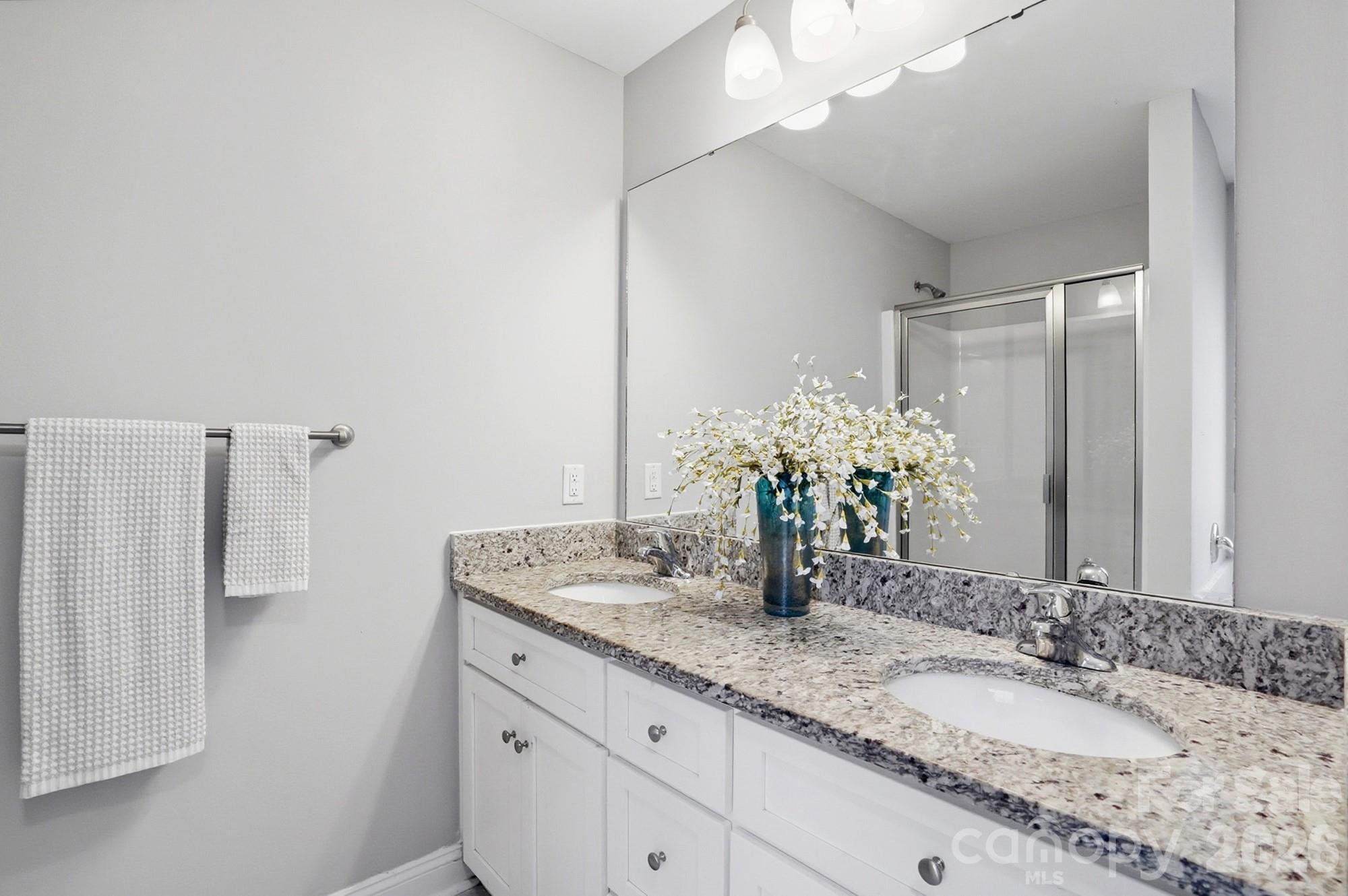 2122 Centergrove Road Kannapolis, NC 28083 - Photo 24 of 47 a bathroom with a granite countertop sink and a mirror