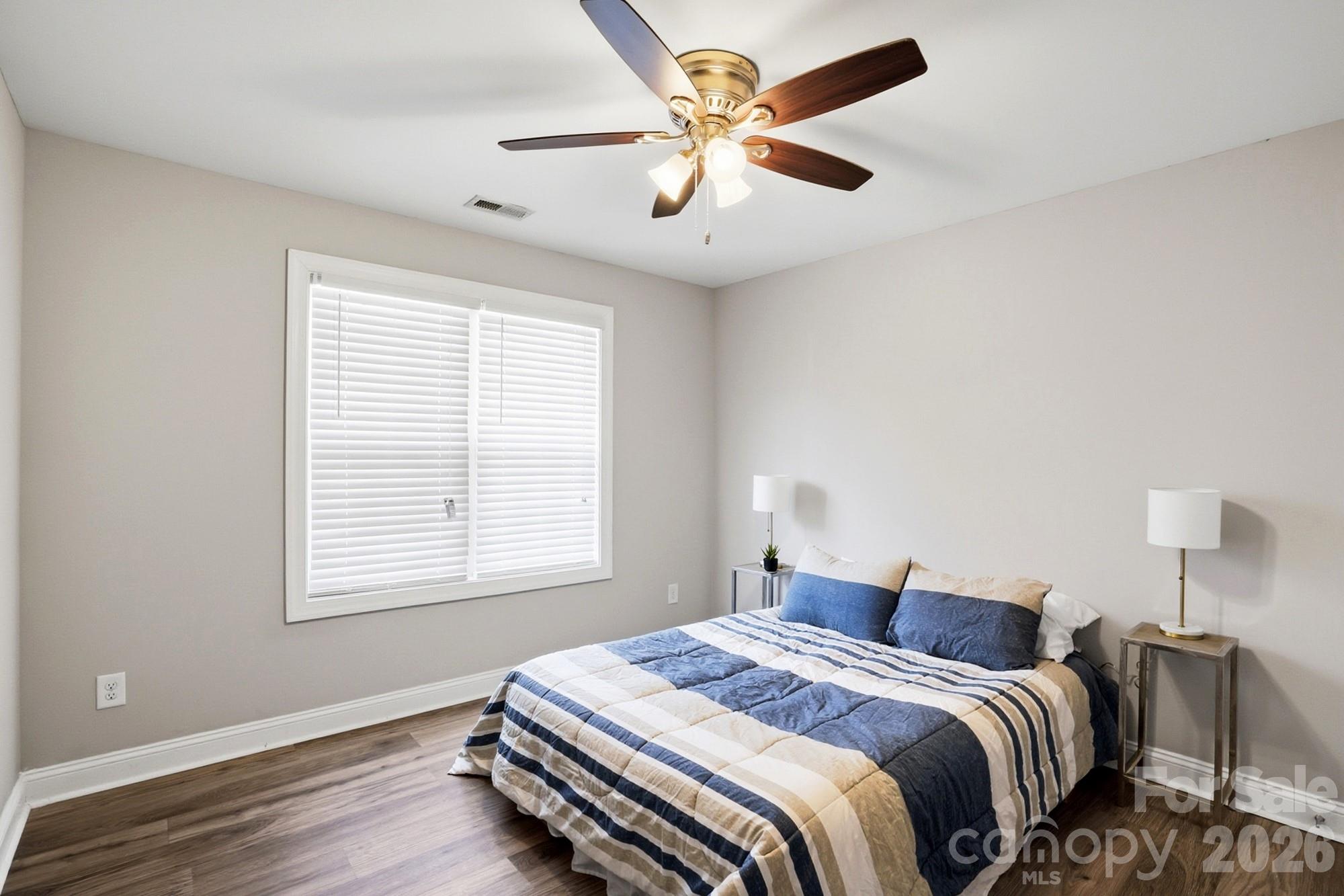 2122 Centergrove Road Kannapolis, NC 28083 - Photo 27 of 47 a bedroom with a bed ceiling fan and a window