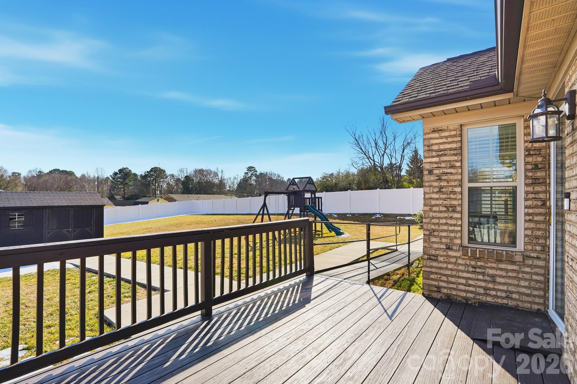 2122 Centergrove Road Kannapolis, NC 28083 - Photo 35 of 47 a view of a balcony with wooden floor and iron fence