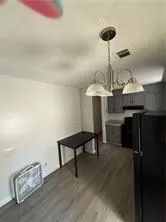 a kitchen with a table and chairs