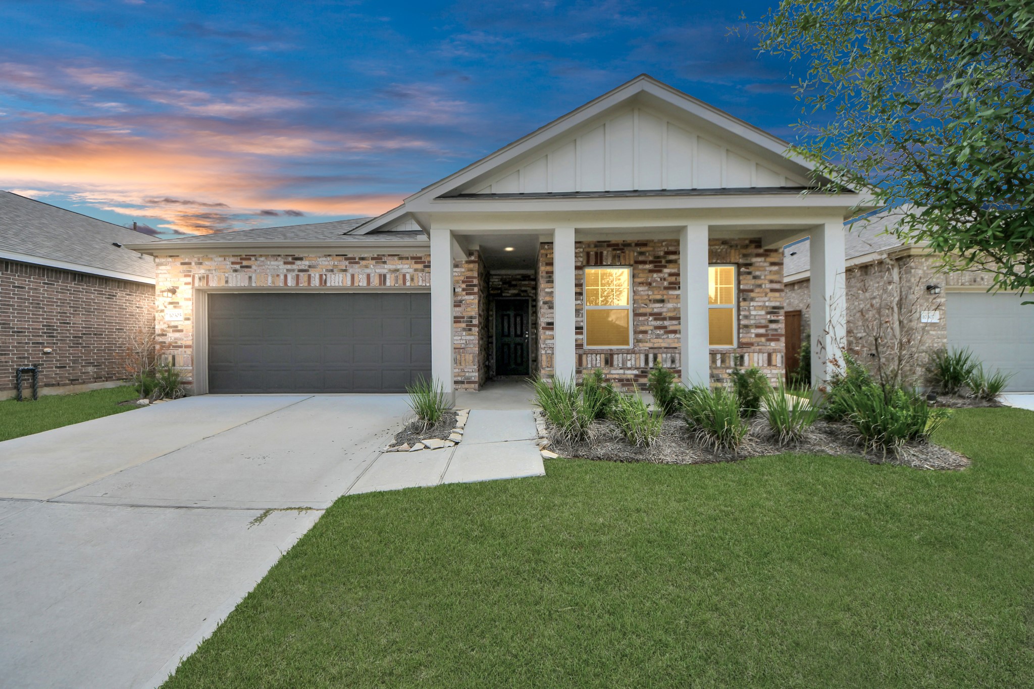 10306 Tuscan Valley Drive Rosharon, TX 77583 - Photo 34 of 48 a front view of a house with a yard and garage