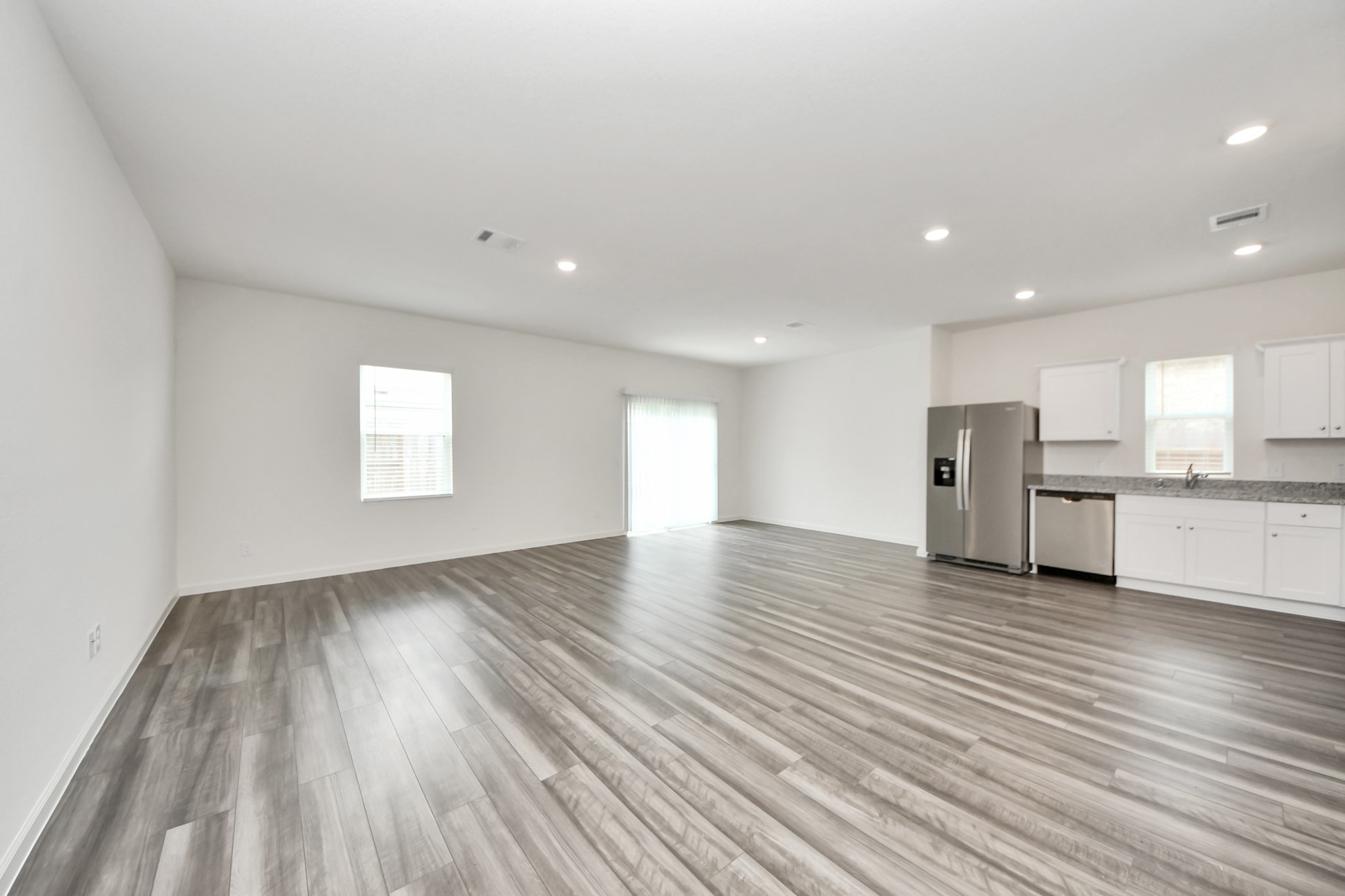 10306 Tuscan Valley Drive Rosharon, TX 77583 - Photo 10 of 48 a view of empty room with wooden floor