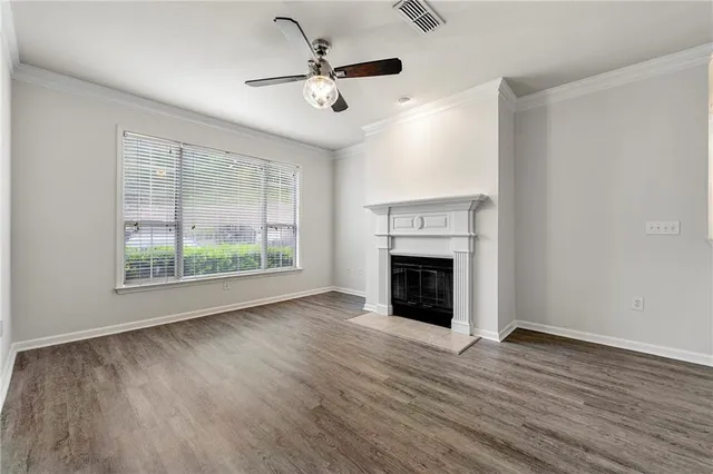 a view of a kitchen with a dishwasher and a fireplace