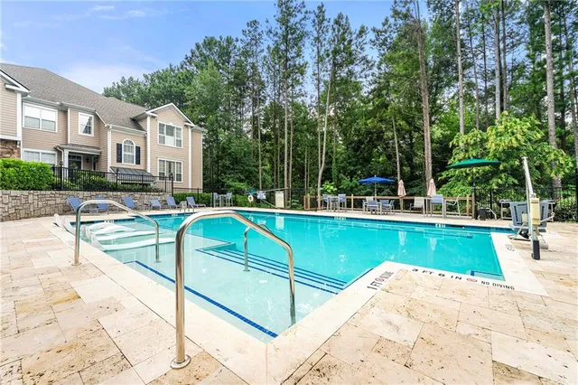 a view of a patio with swimming pool