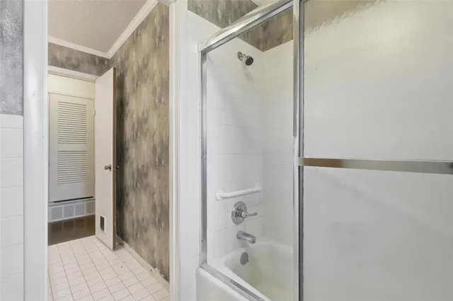 a view of an empty room and wooden floor