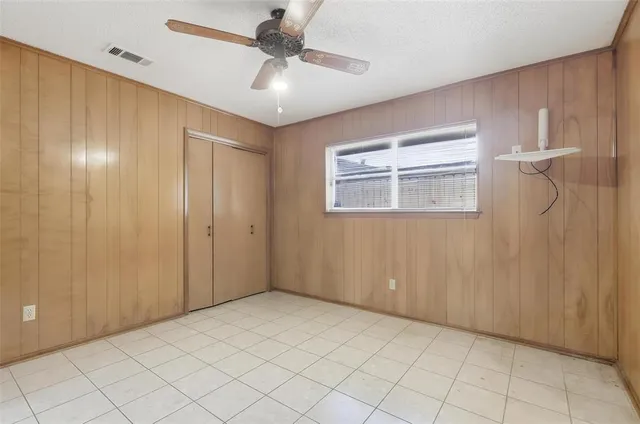 a dining room with furniture and a window