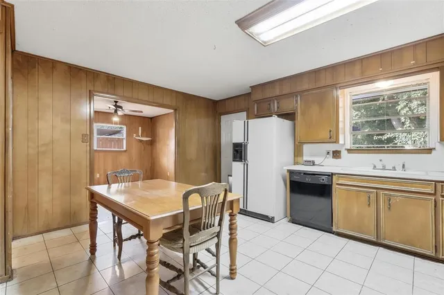 a view of a hallway with chairs and painted walls