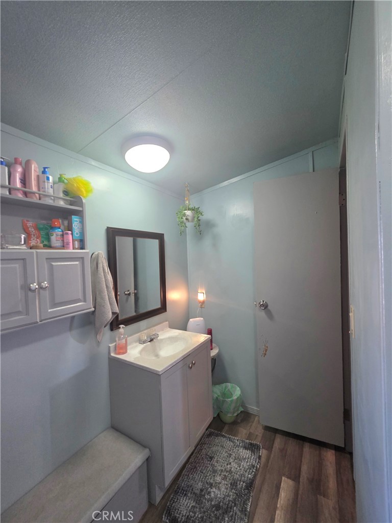 10623 Desert View Road Pinon Hills, CA 92372 - Photo 15 of 76 a bathroom with a tub sink and a mirror