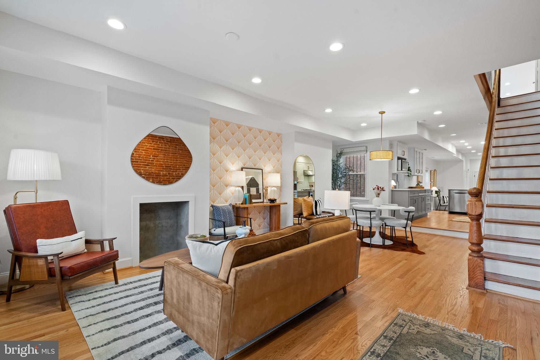 525 14th Street Southeast Washington, DC 20003 - Photo 3 of 41 a living room with furniture a rug and a fireplace