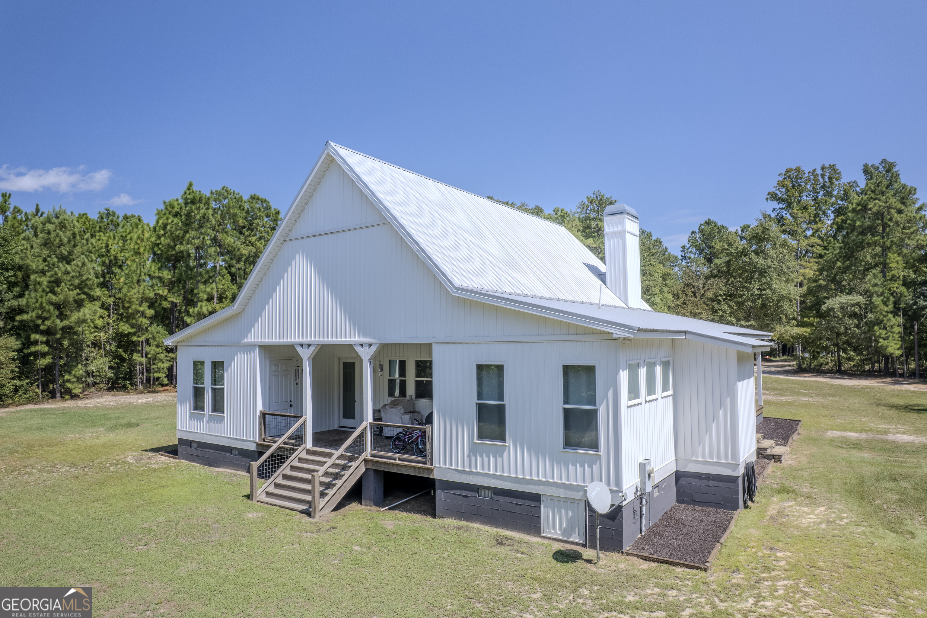 221 Butler Road Southeast Milledgeville, GA 31061 - Photo 13 of 60 a view of a house with a yard and sitting area