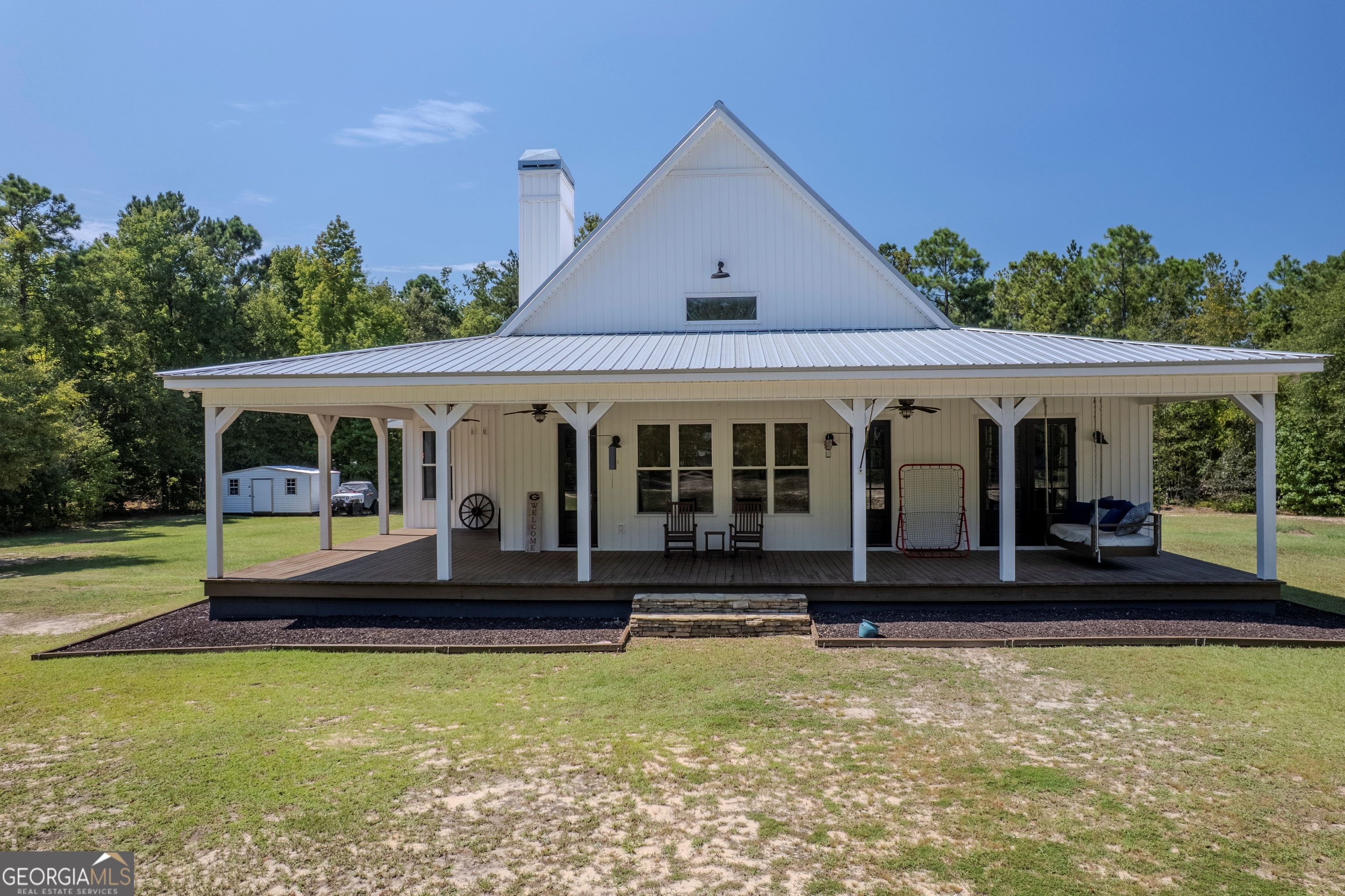 221 Butler Road Southeast Milledgeville, GA 31061 - Photo 14 of 60 a front view of a house with swimming pool