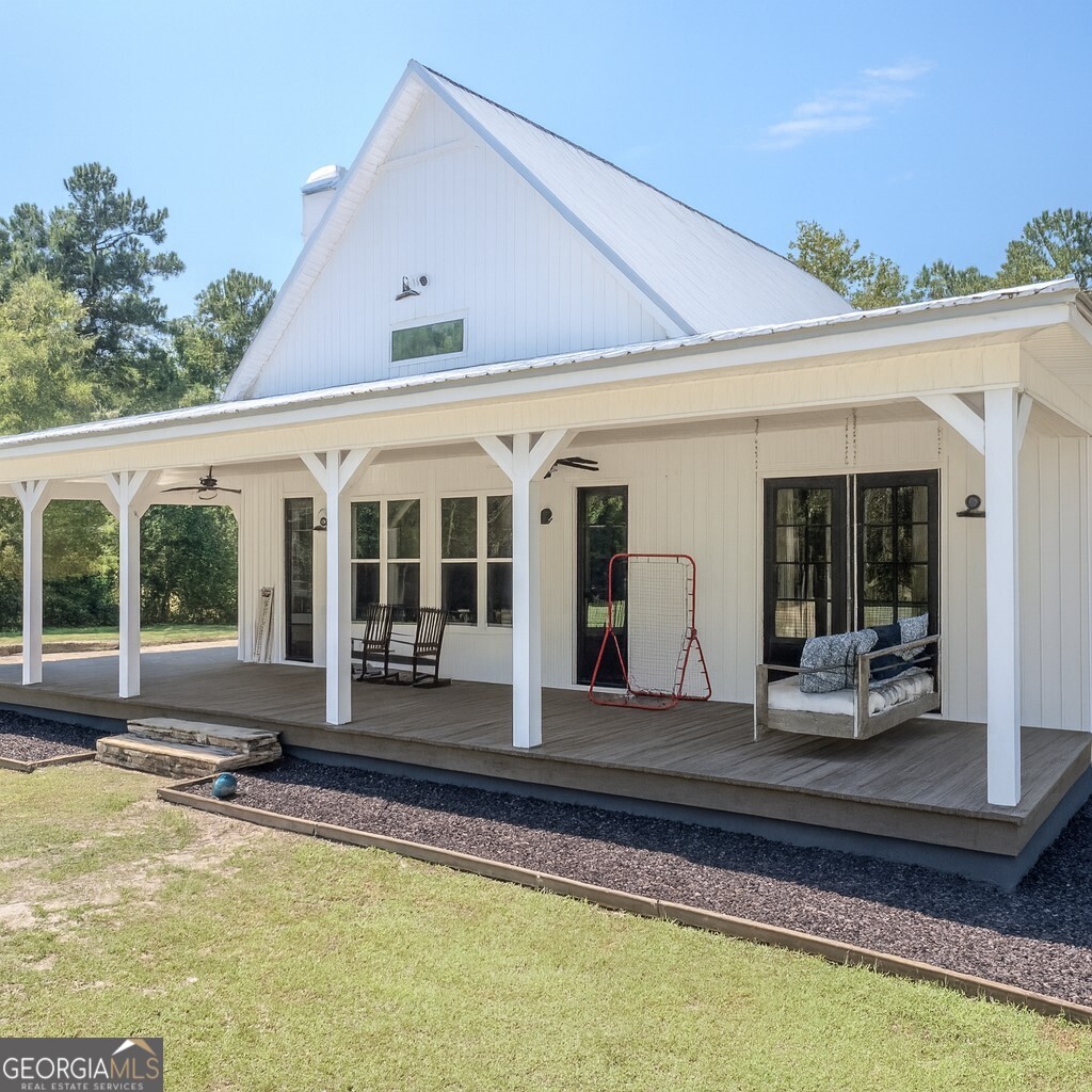 221 Butler Road Southeast Milledgeville, GA 31061 - Photo 2 of 60 a view of a house with swimming pool and porch