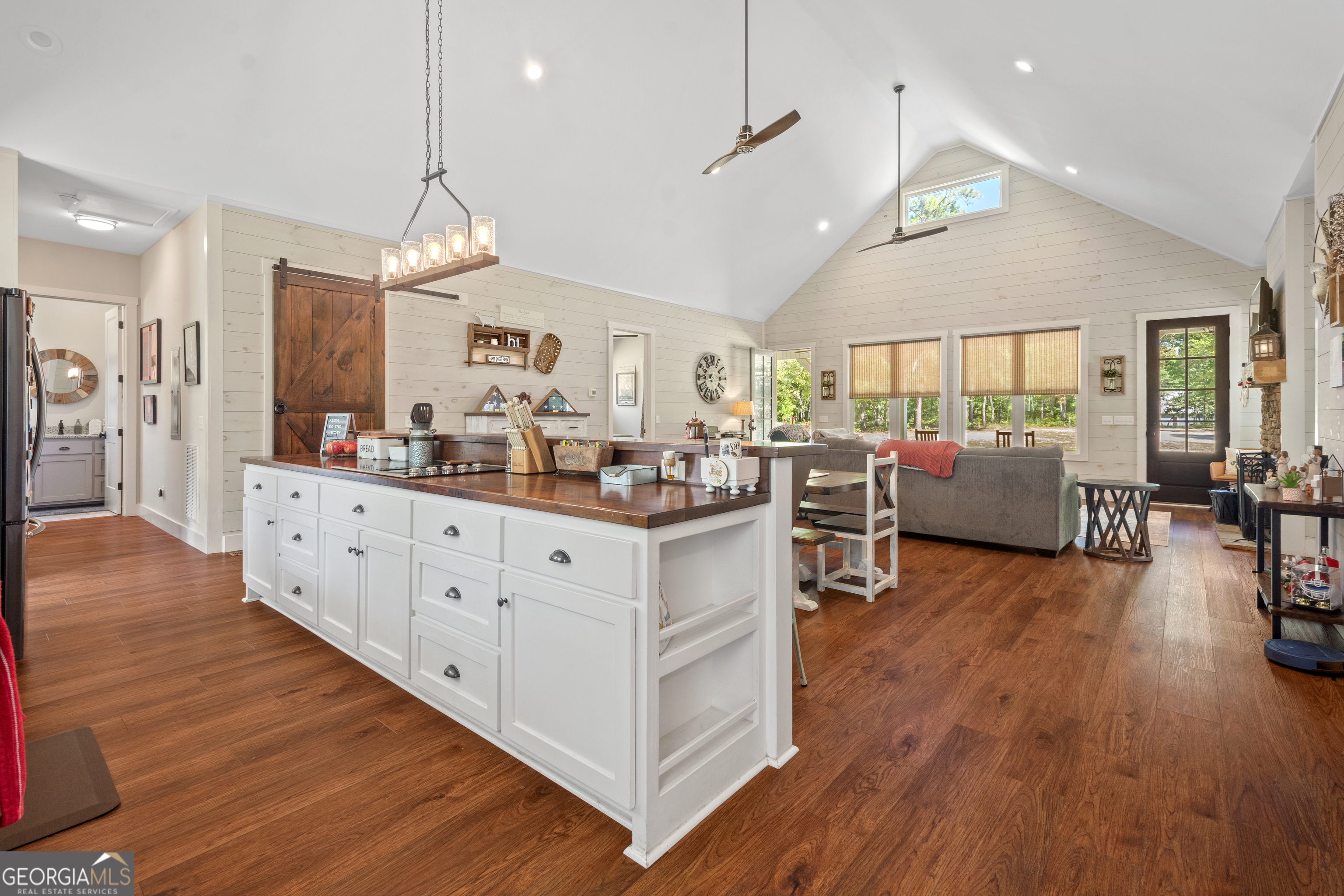 221 Butler Road Southeast Milledgeville, GA 31061 - Photo 25 of 60 a large kitchen with lots of counter space a sink appliances and living room view