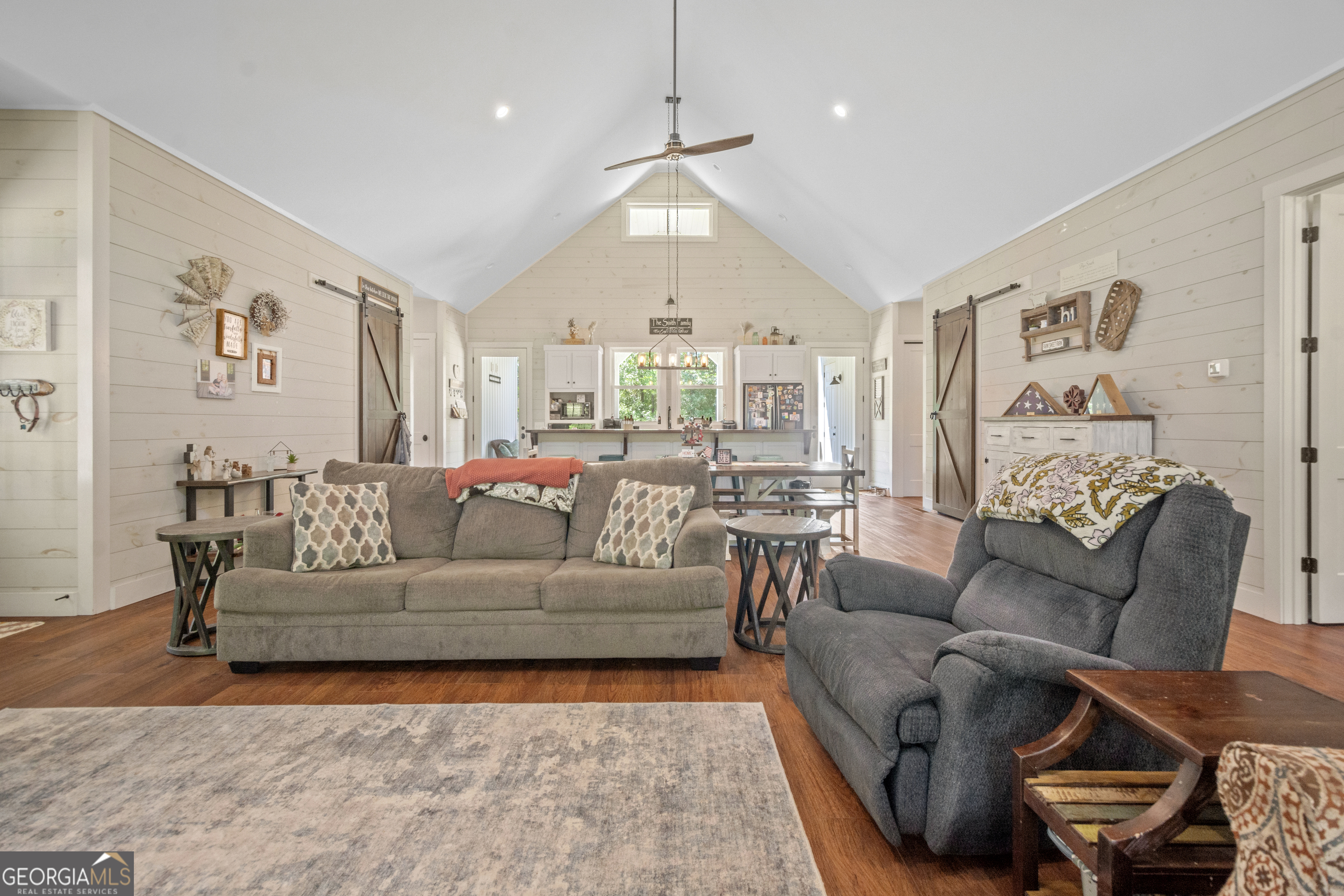 221 Butler Road Southeast Milledgeville, GA 31061 - Photo 31 of 60 a living room with furniture and a chandelier