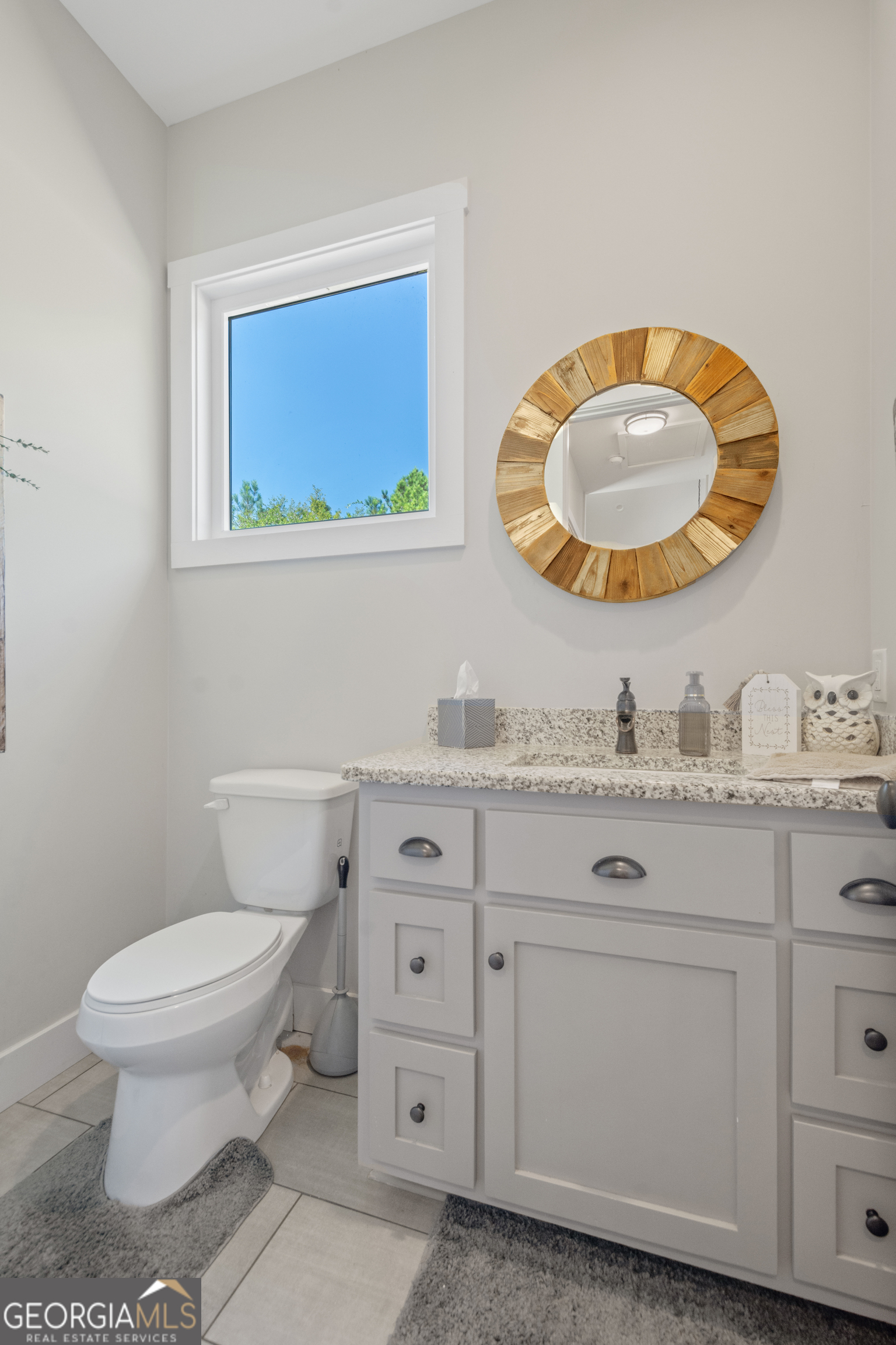 221 Butler Road Southeast Milledgeville, GA 31061 - Photo 52 of 60 a bathroom with a toilet sink vanity and mirror