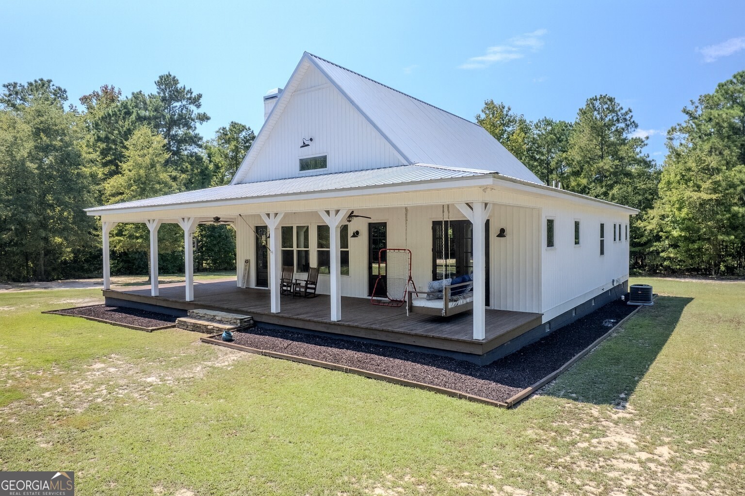 221 Butler Road Southeast Milledgeville, GA 31061 - Photo 6 of 60 a view of a house with pool in front of it