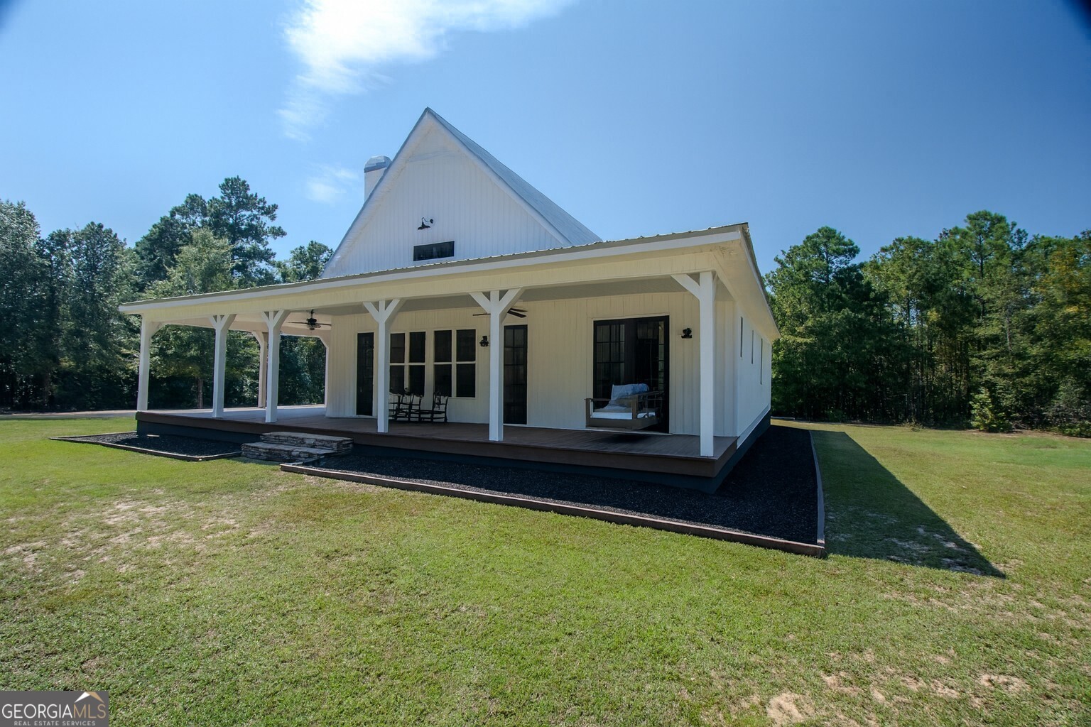 221 Butler Road Southeast Milledgeville, GA 31061 - Photo 7 of 60 a view of house with backyard space and balcony