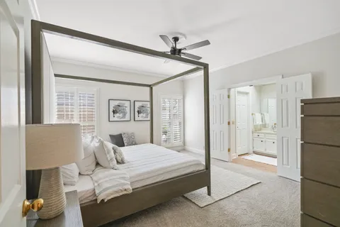 a bedroom with a bed and a couch