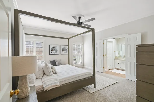 a bedroom with a bed and a couch