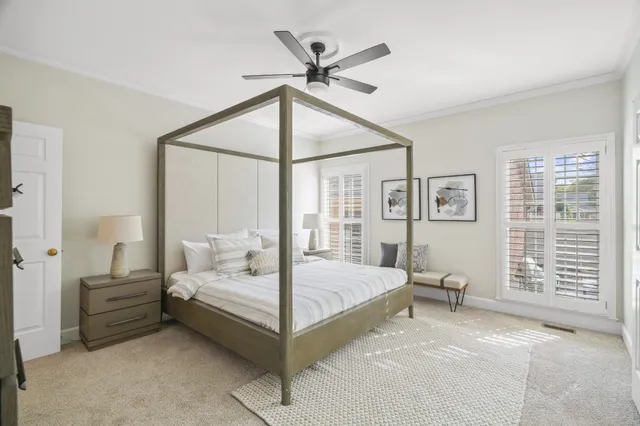 a spacious bathroom with a granite countertop sink toilet and shower
