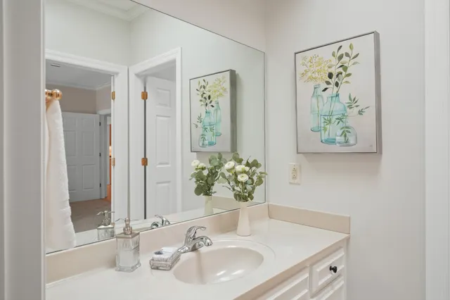 a bathroom with a granite countertop sink a toilet and a bathtub