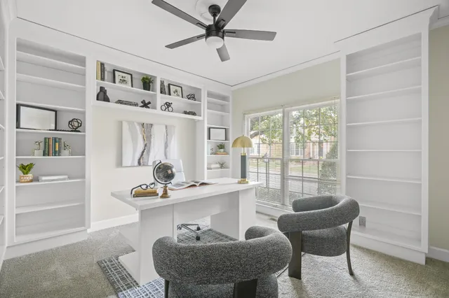 a living room with furniture and a lamp
