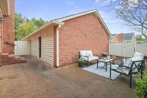 a view of a bench in the backyard