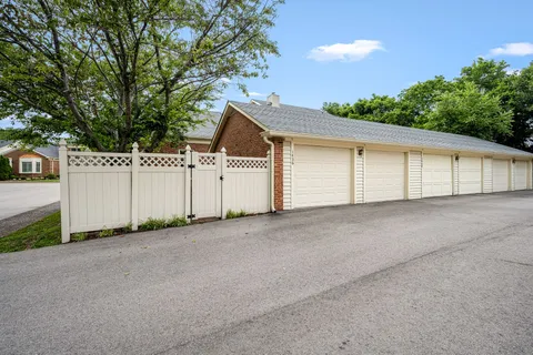a view of a white house with a outdoor space and window