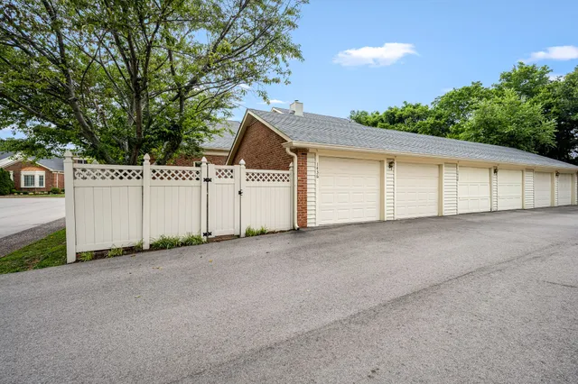 a view of a white house with a outdoor space and window