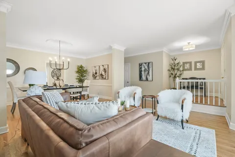 a living room with furniture and a table