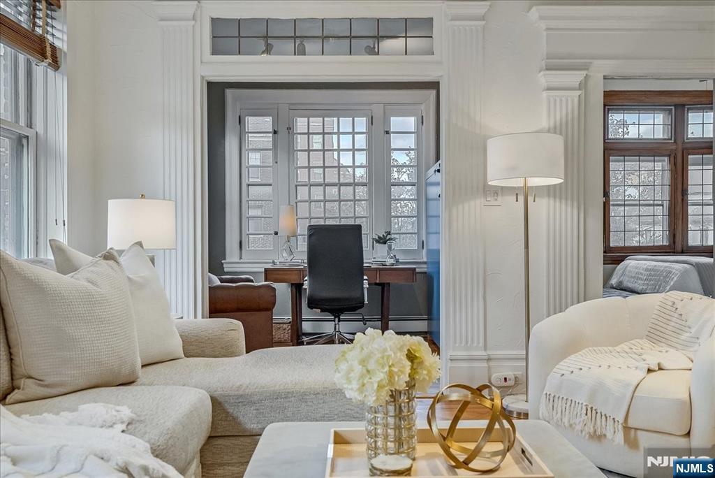 a living room with furniture and a fireplace