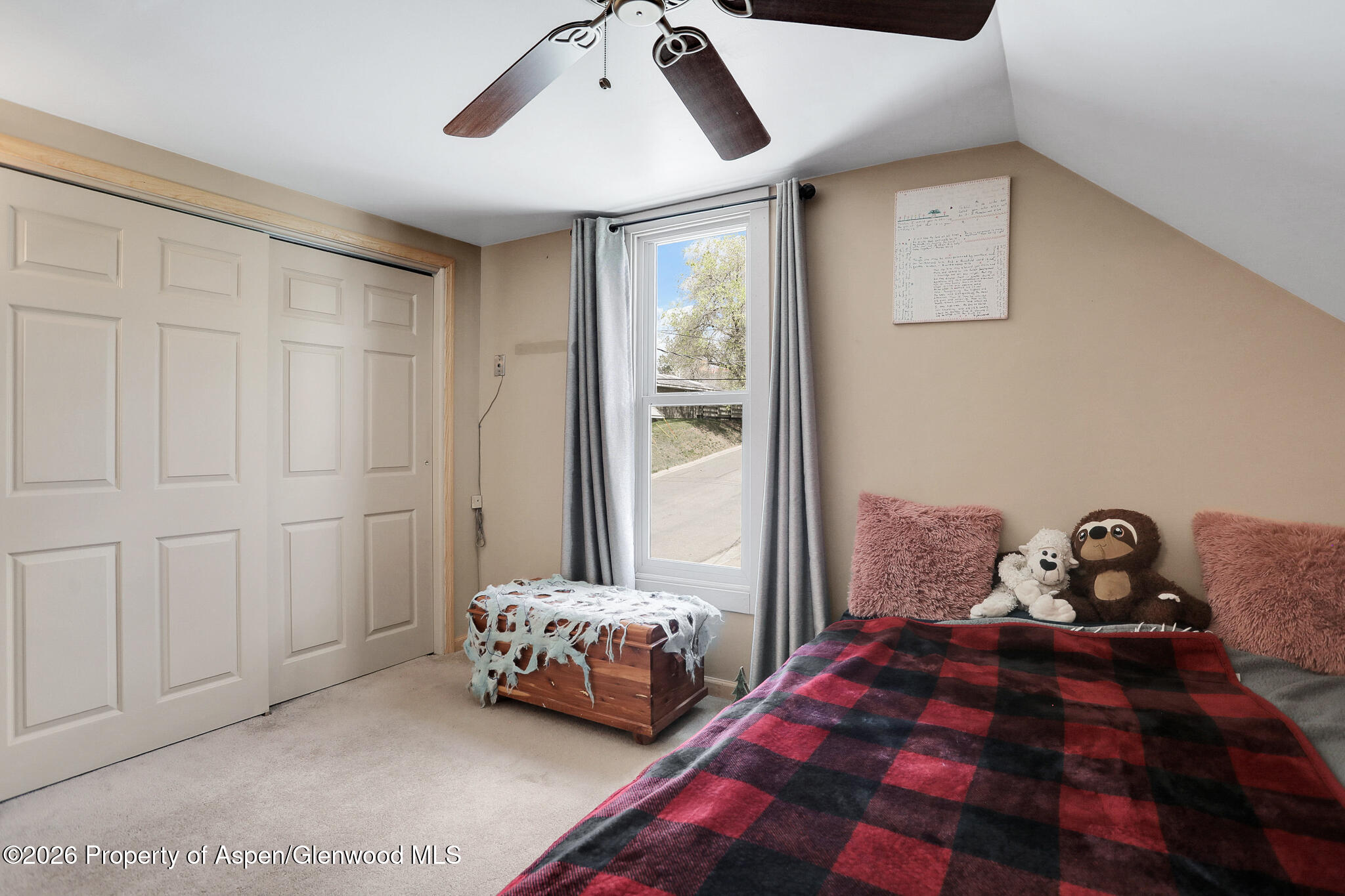 595 Colorado Street Craig, CO 81625 - Photo 19 of 31 a bedroom with bed and window
