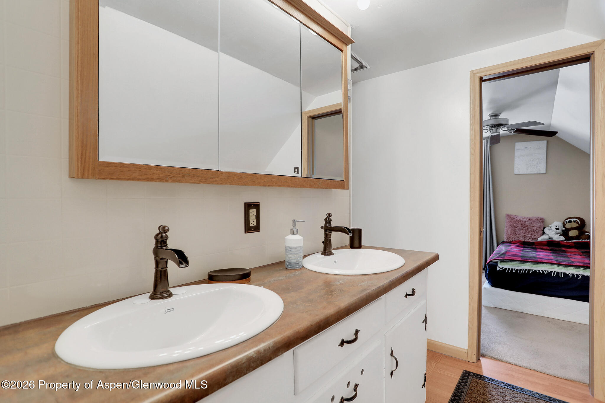 595 Colorado Street Craig, CO 81625 - Photo 25 of 31 a bathroom with a sink and a mirror