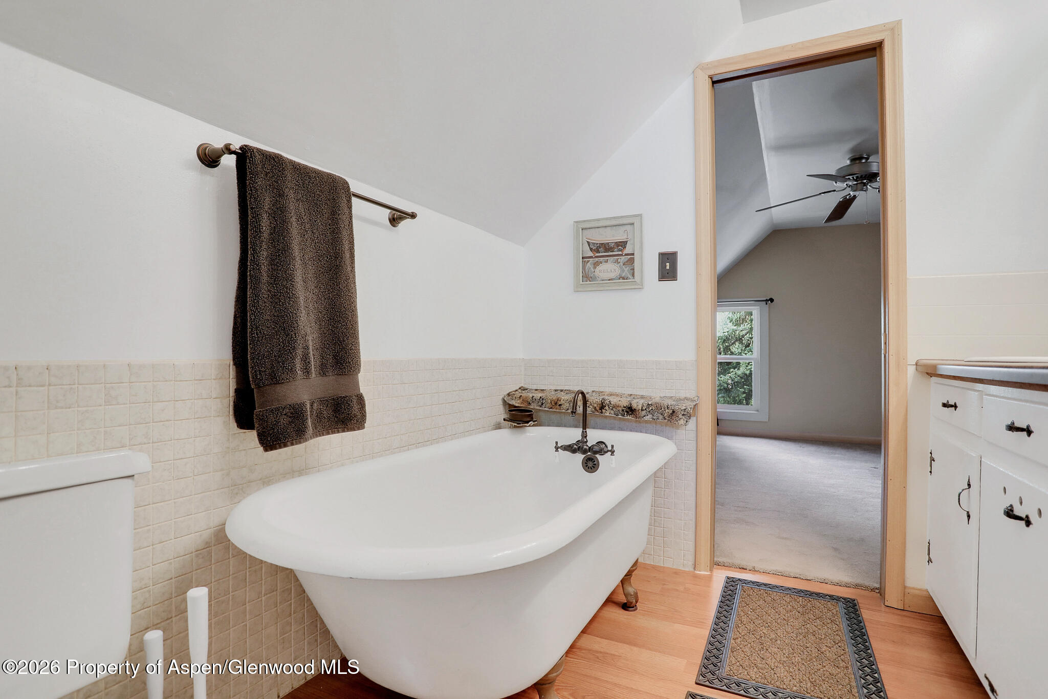 595 Colorado Street Craig, CO 81625 - Photo 27 of 31 a bathroom with a bathtub and a shower