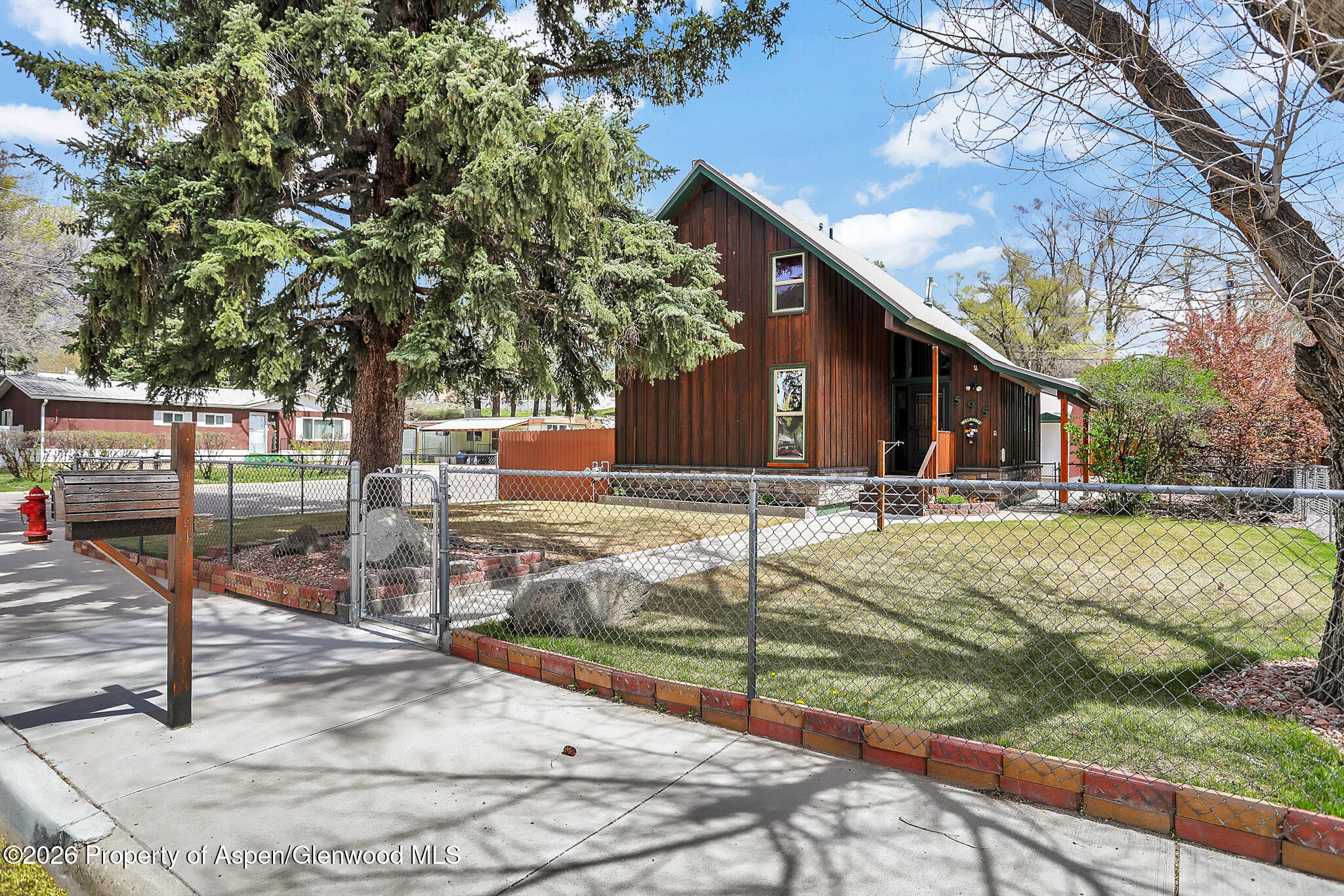 595 Colorado Street Craig, CO 81625 - Photo 3 of 31 a view of a house with backyard