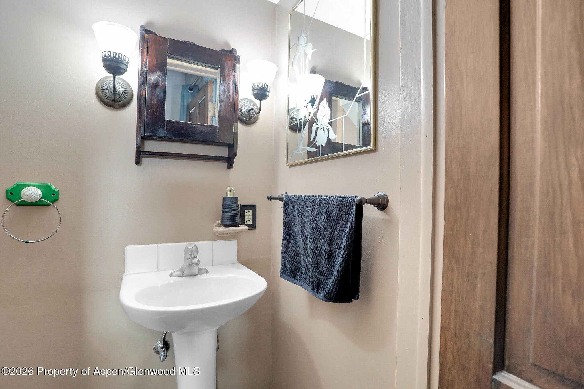595 Colorado Street Craig, CO 81625 - Photo 31 of 31 a bathroom with a sink and a mirror