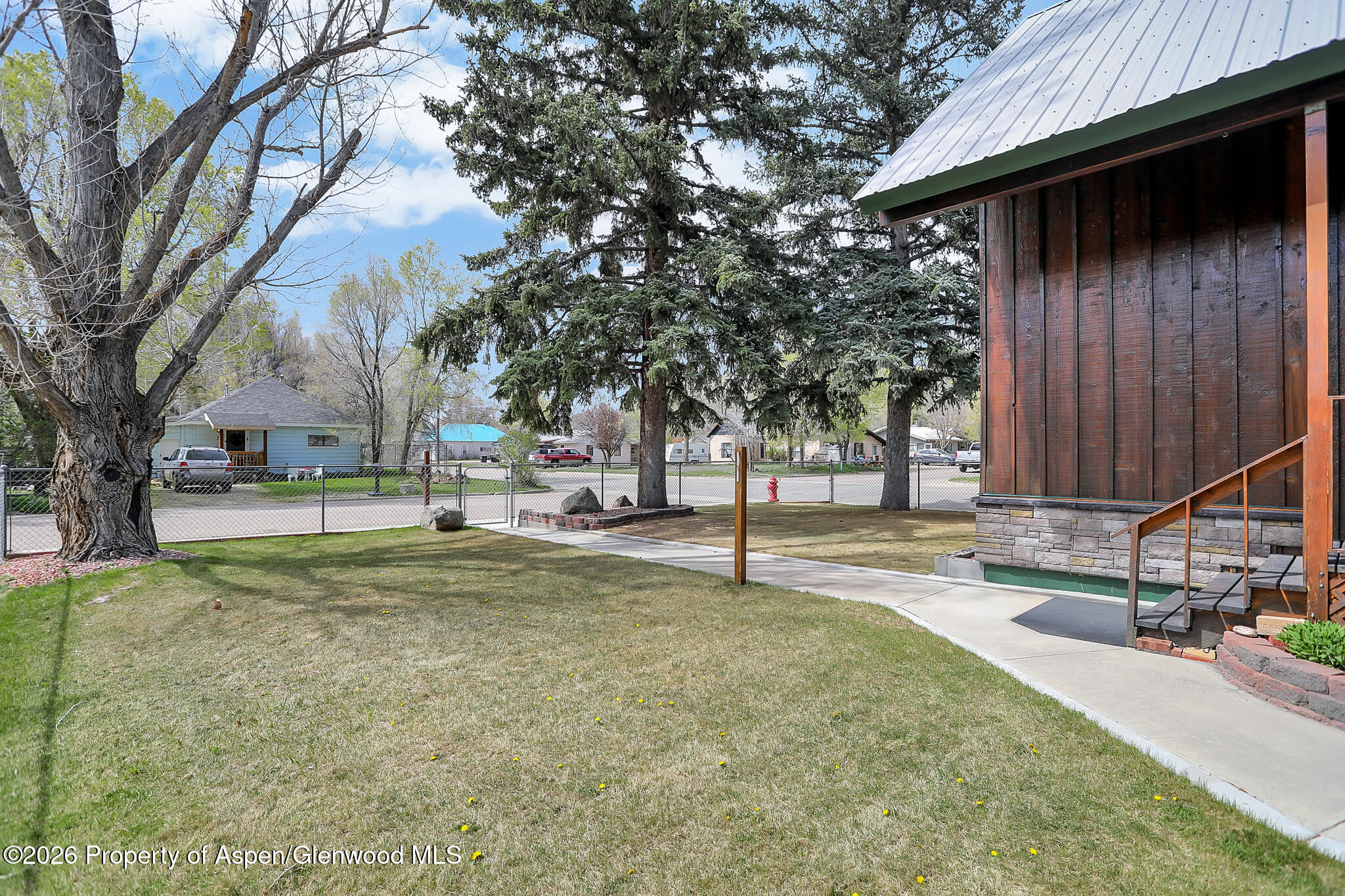 595 Colorado Street Craig, CO 81625 - Photo 9 of 31 a view of yard with tree s