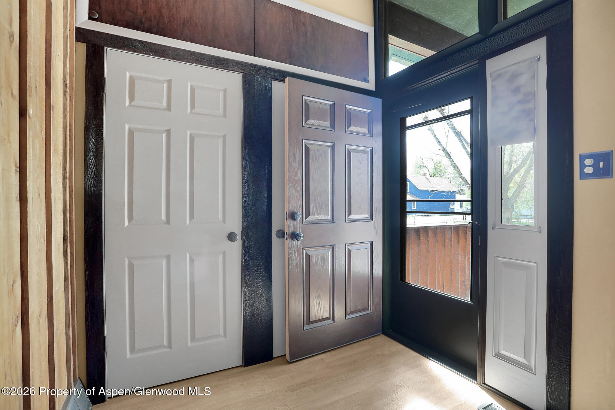 595 Colorado Street Craig, CO 81625 - Photo 10 of 31 a view of a hallway with wooden floor and windows