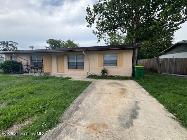 2389 Victor Road Cocoa, FL 32926 - Photo 1 of 12 a front view of a house with garden