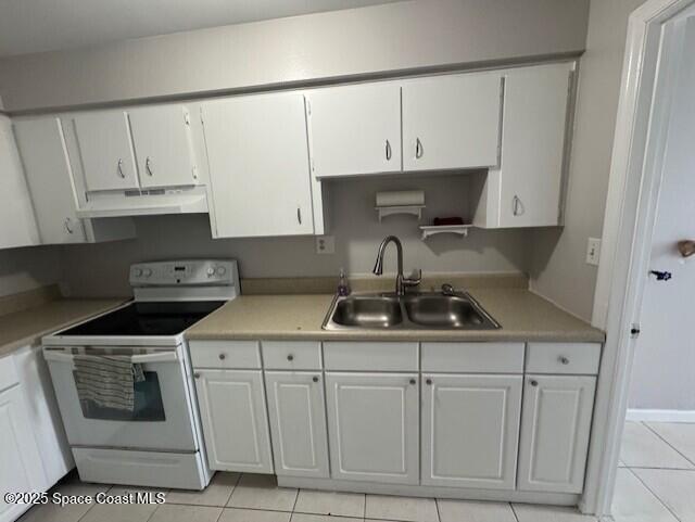 2389 Victor Road Cocoa, FL 32926 - Photo 6 of 12 a kitchen with white cabinets and white appliances