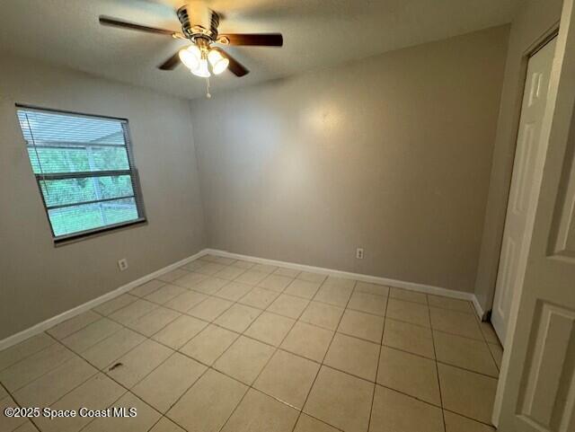 2389 Victor Road Cocoa, FL 32926 - Photo 8 of 12 an empty room with windows and fan