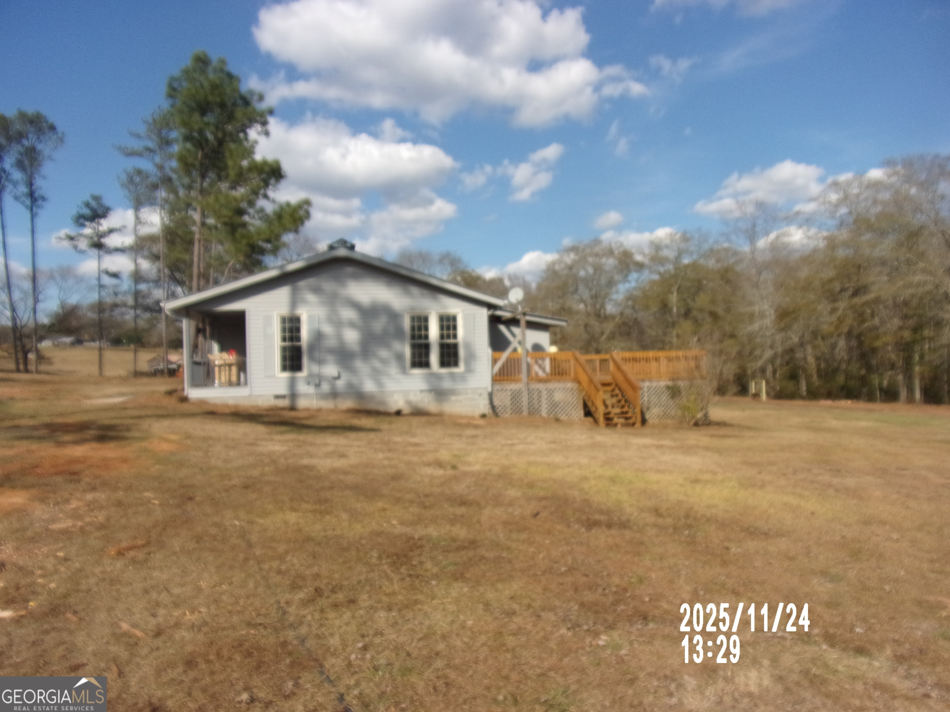 781 North Delray Road Thomaston, GA 30286 - Photo 13 of 63 a view of a house with backyard and trees