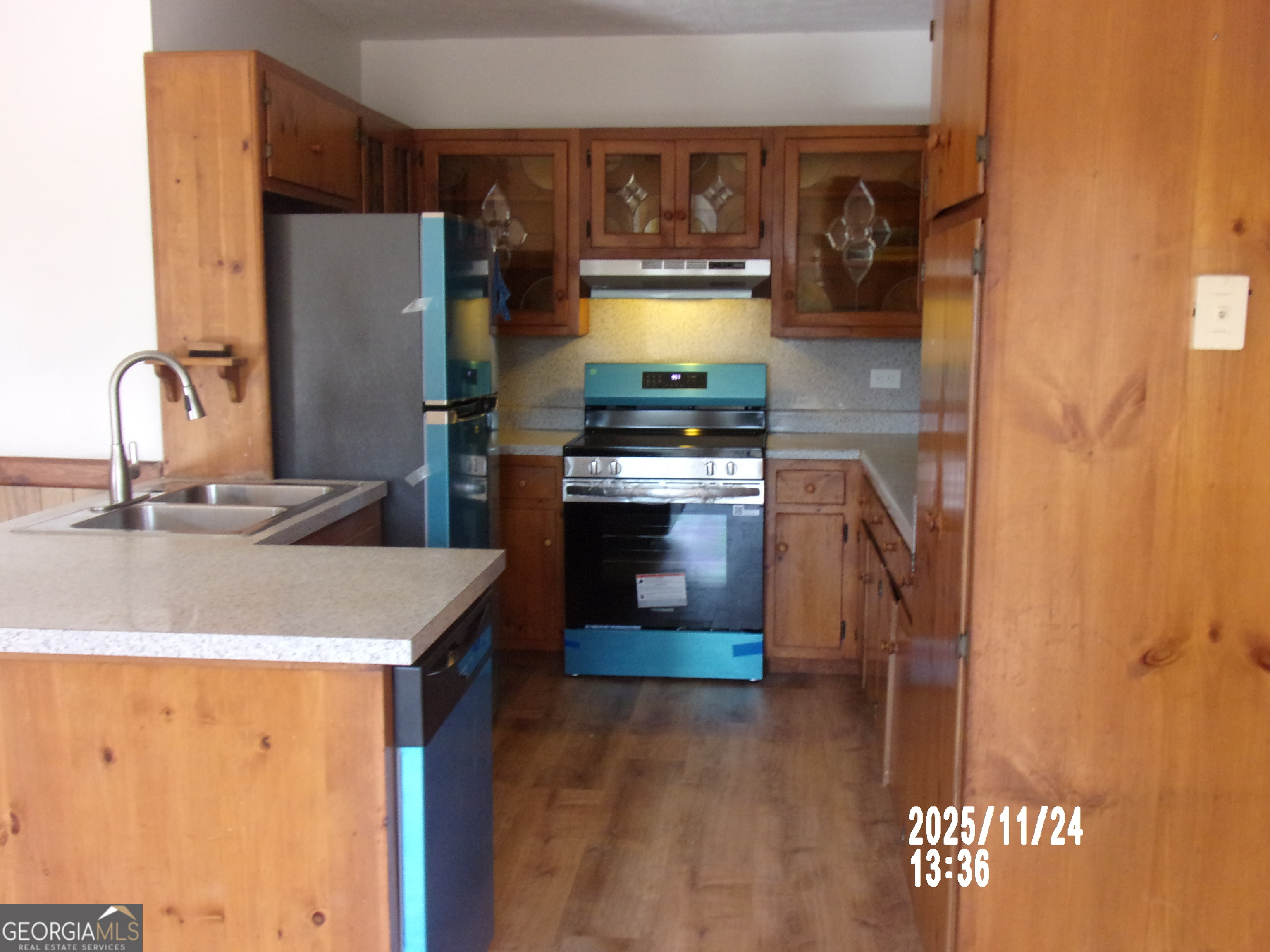 781 North Delray Road Thomaston, GA 30286 - Photo 26 of 63 a kitchen with stainless steel appliances granite countertop a sink a stove and a refrigerator
