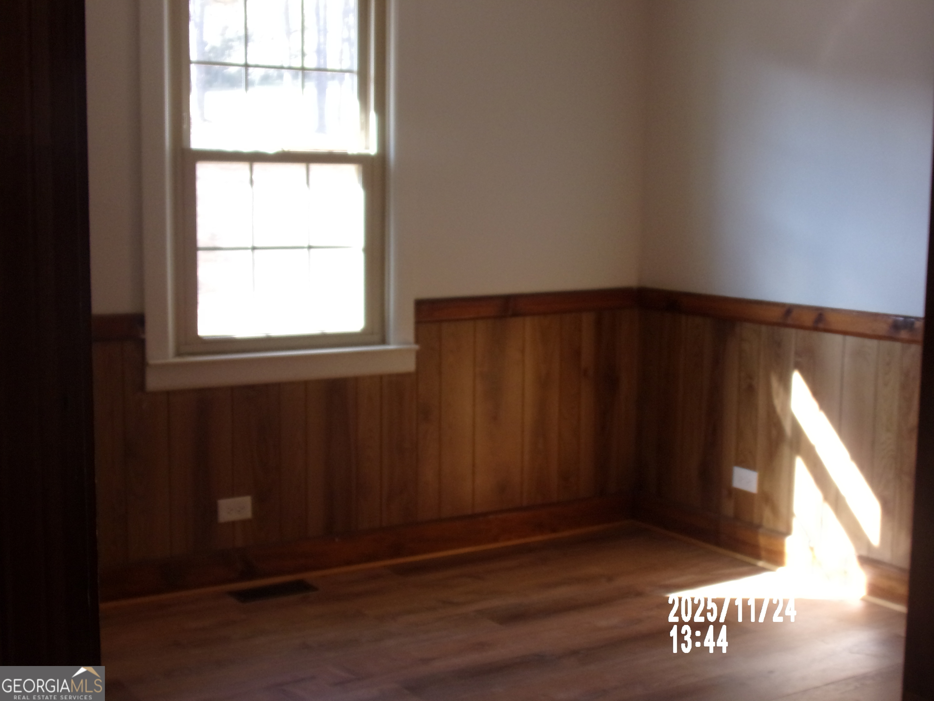 781 North Delray Road Thomaston, GA 30286 - Photo 51 of 63 an empty room with wooden floor and windows