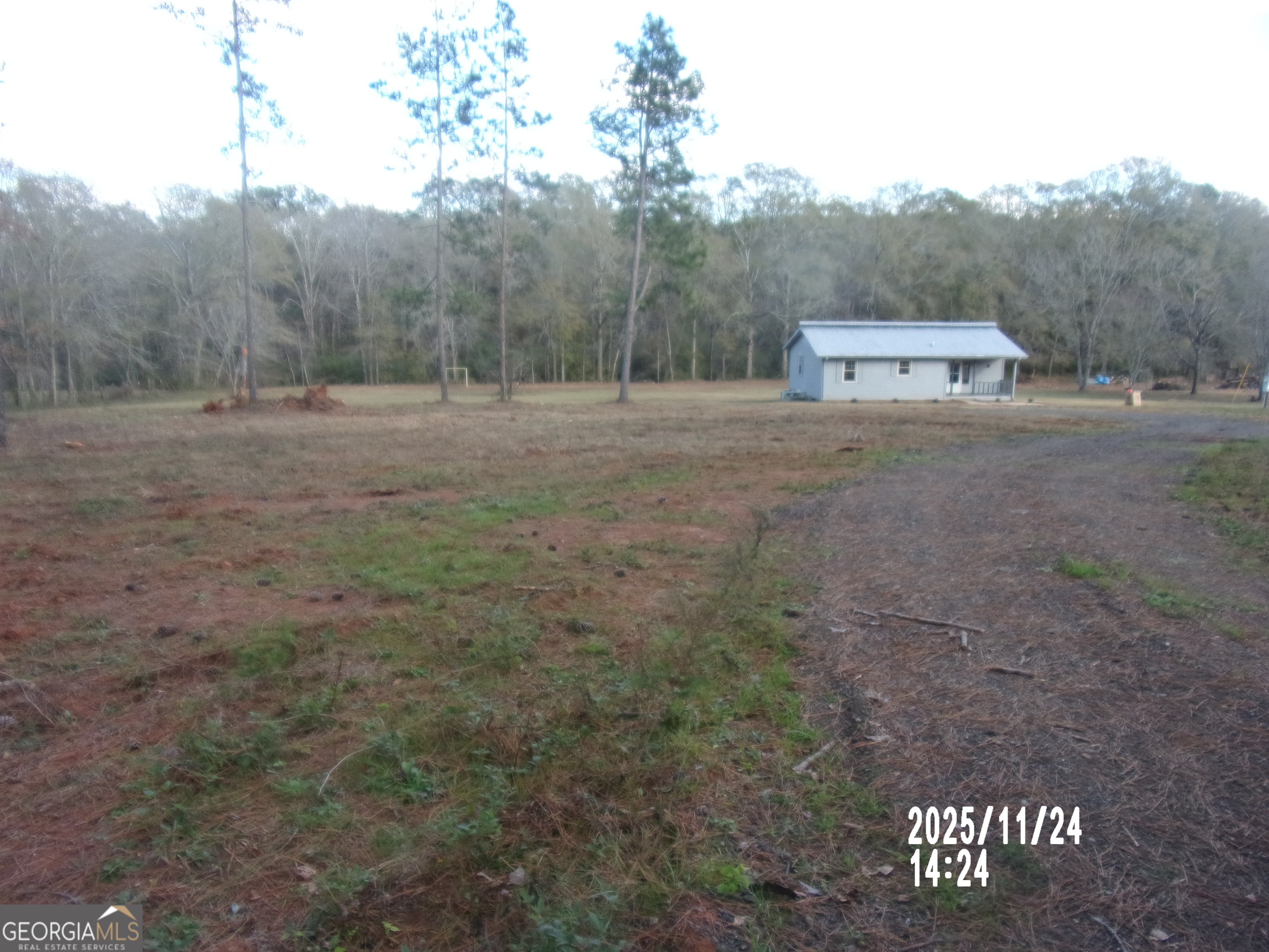 781 North Delray Road Thomaston, GA 30286 - Photo 59 of 63 a view of a field with trees in the background