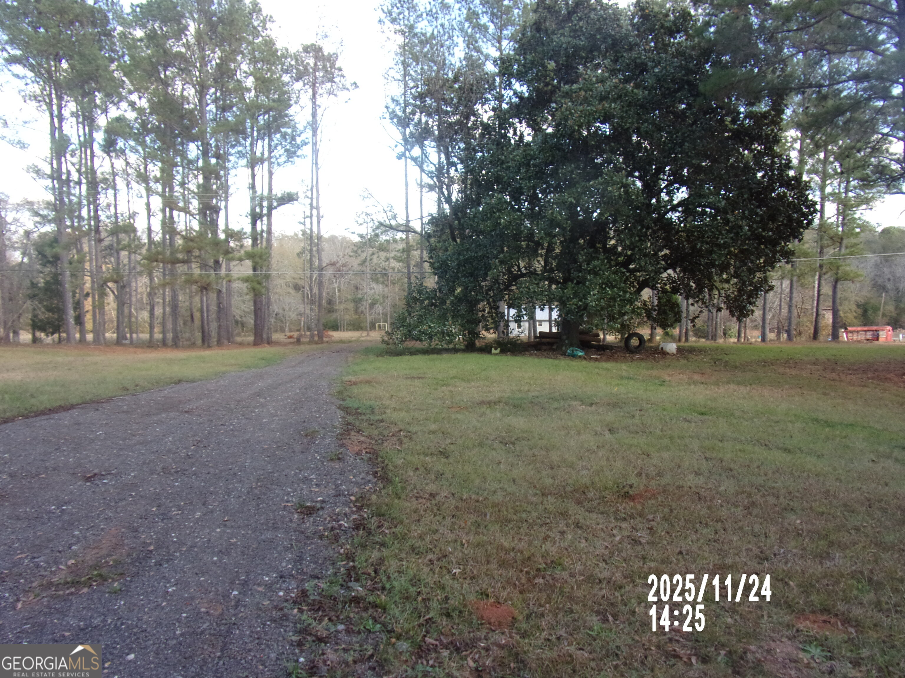 781 North Delray Road Thomaston, GA 30286 - Photo 61 of 63 a view of a field with trees in background